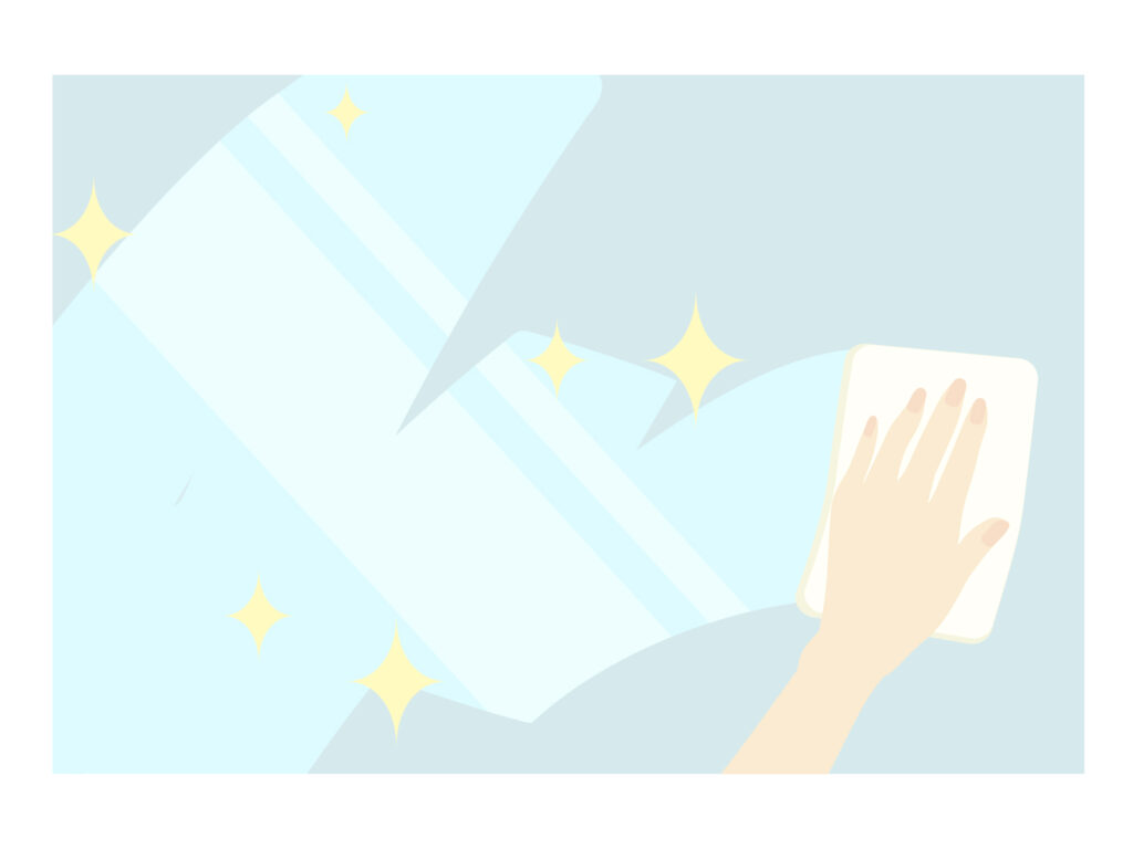 洗剤で窓の汚れを拭いている様子